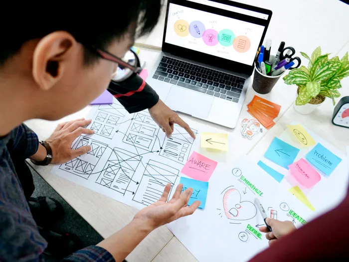 Designer planning a project at a desk